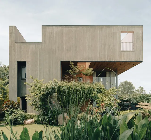 This new family house in Ahmedabad is a solid form with carved-out balconies and terraces
